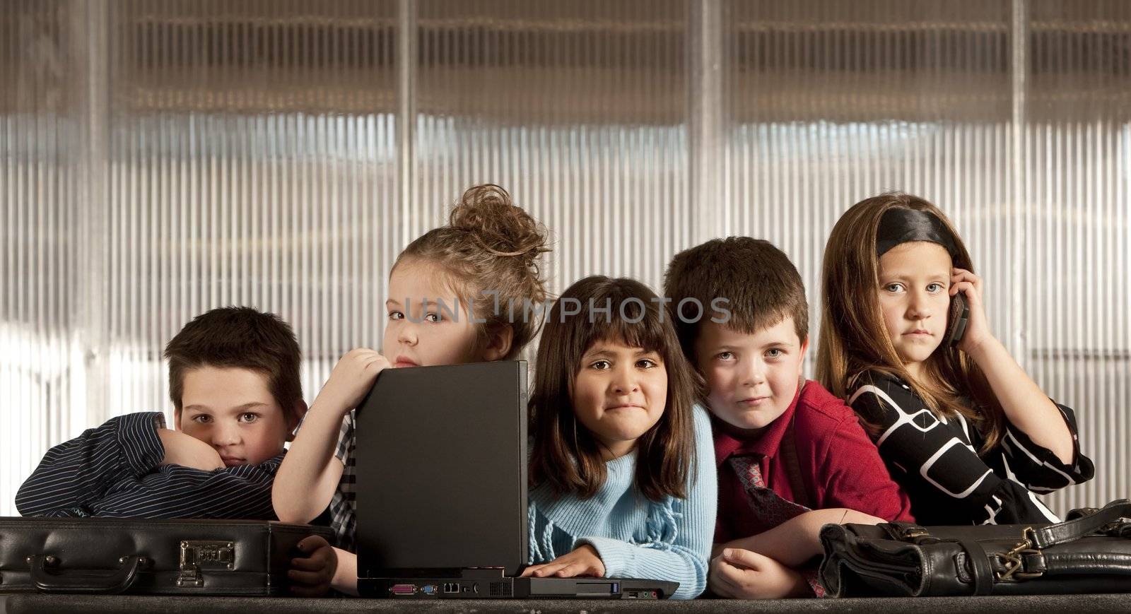 Kids posing as a professional business team