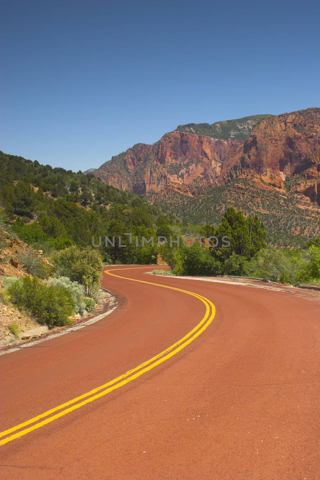 Red road to the mountains of the Zion National park
