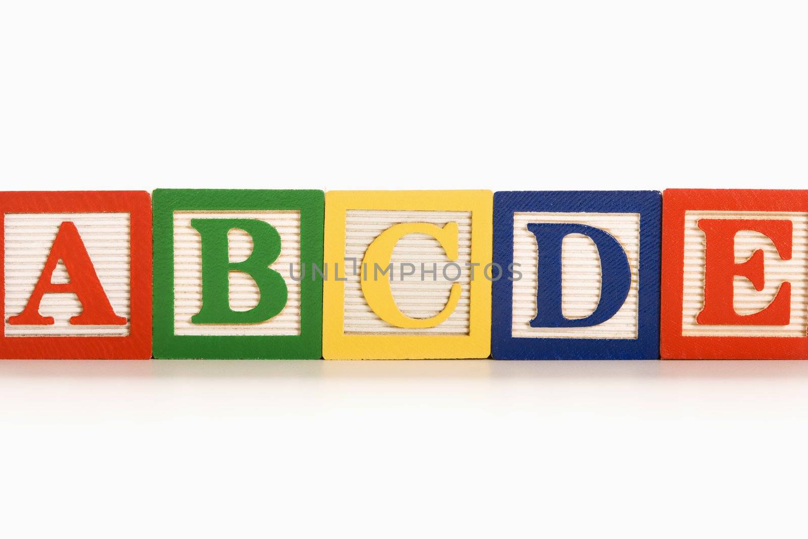 Alphabet blocks lined up in a row.