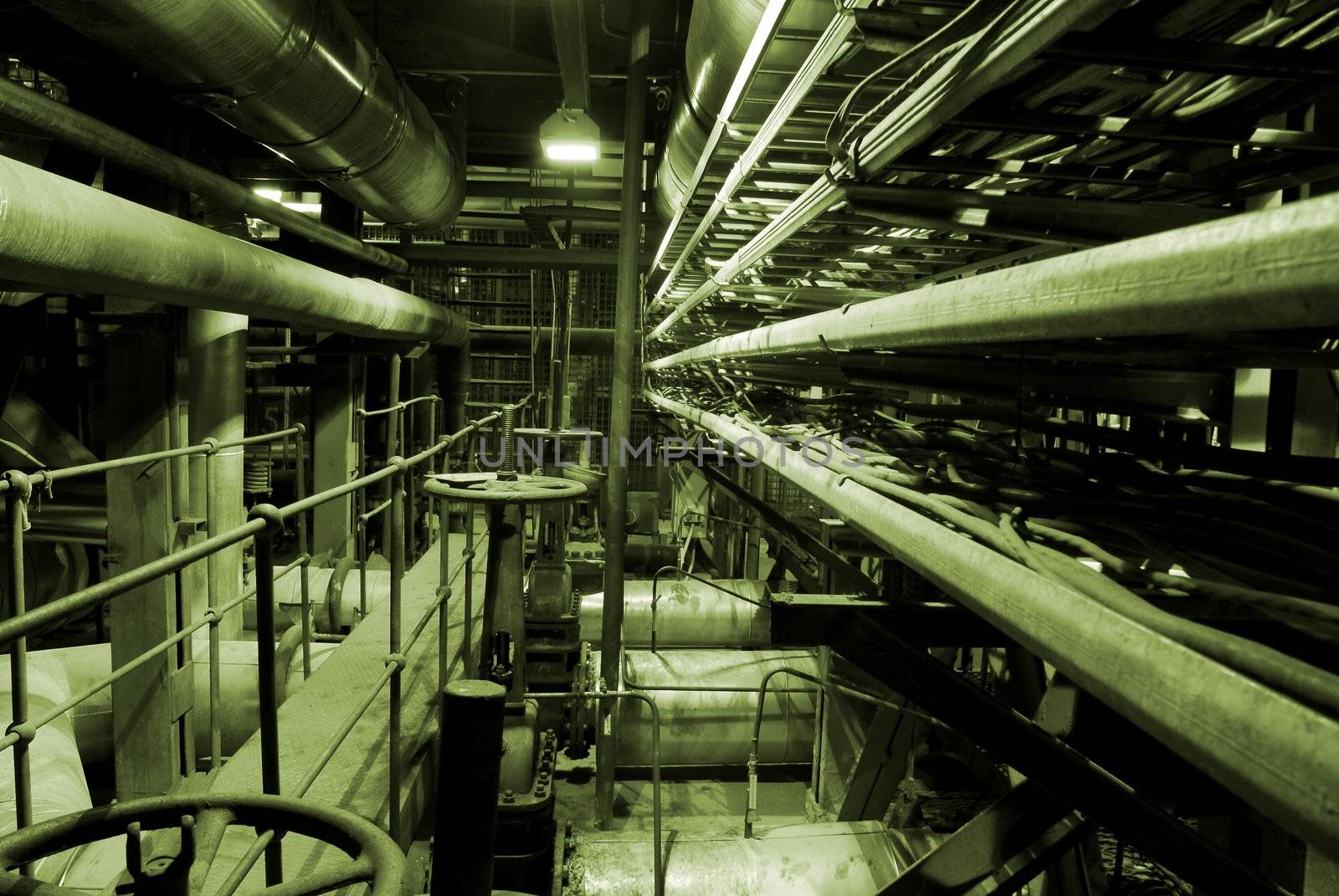 Boilers, ladders and pipes at a power plant     