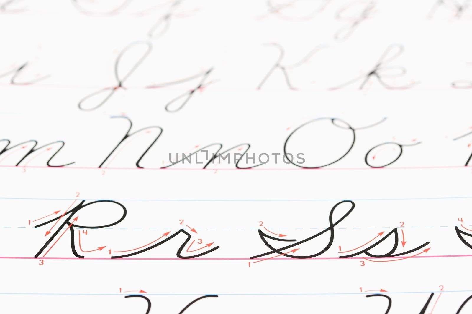 Close up of cursive handwriting practice page.