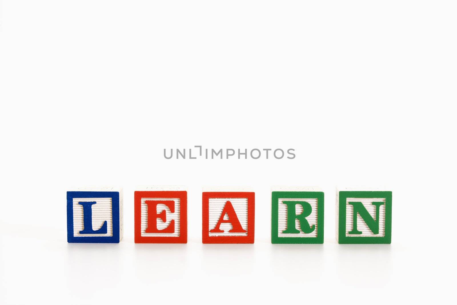 Alphabet toy building blocks spelling the word learn.