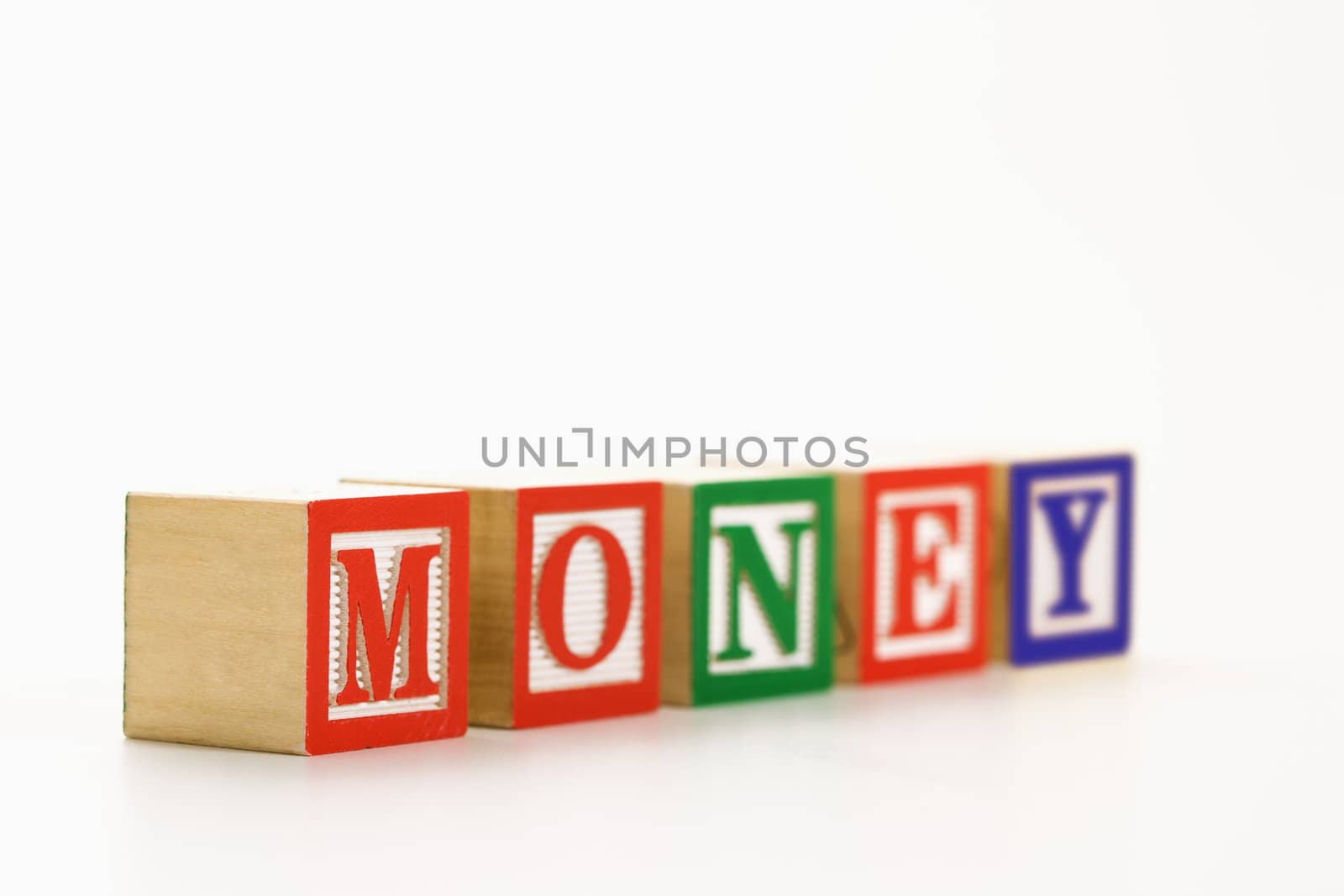 Alphabet toy building blocks spelling the word money.