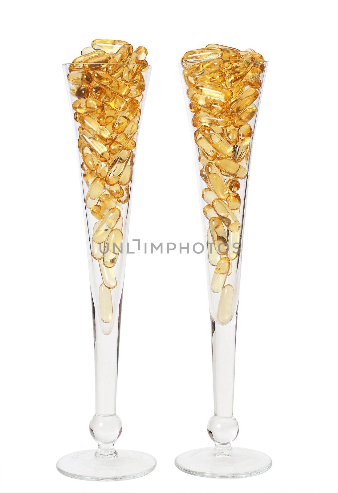 Two glasses with gold shiny boluses