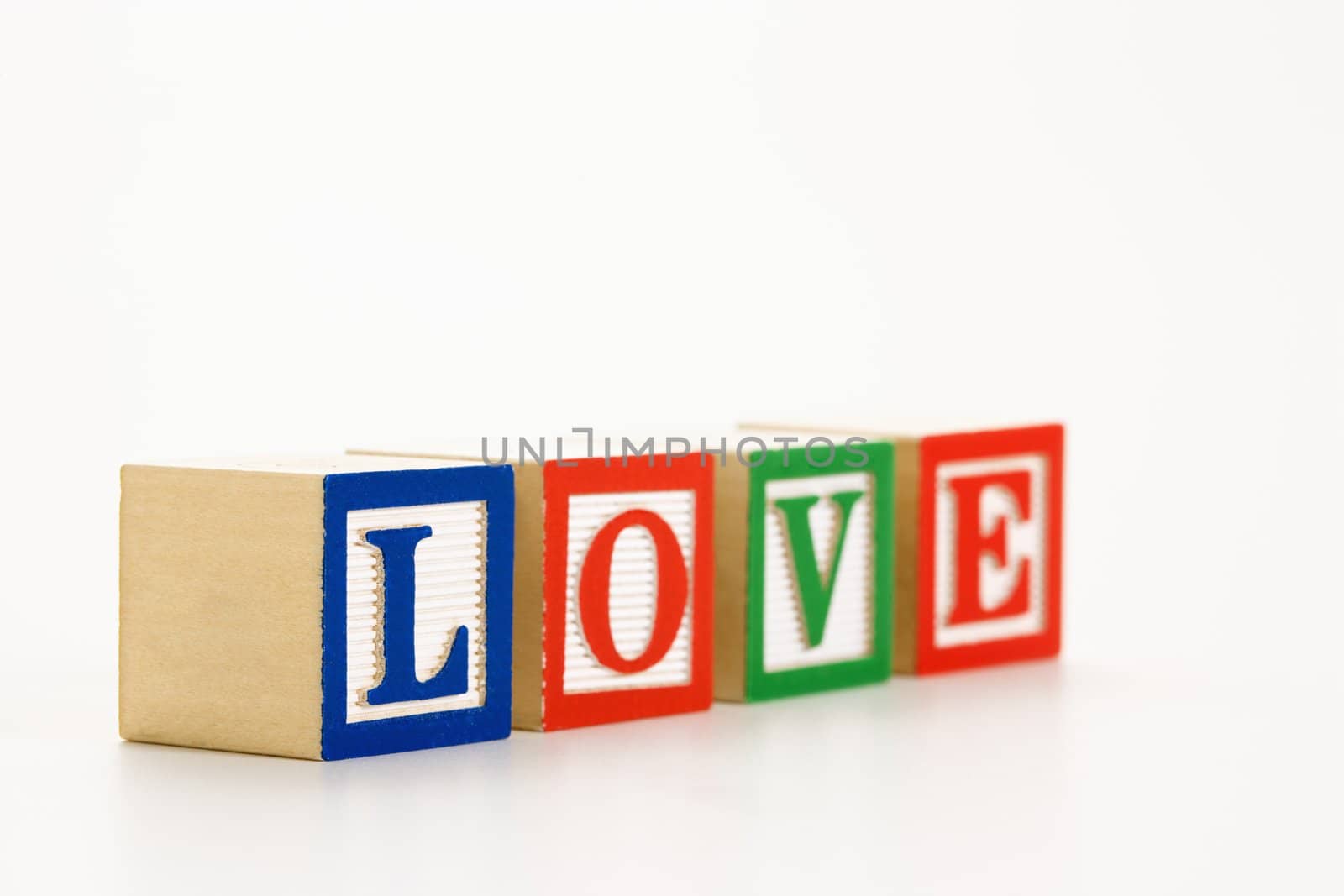 Alphabet toy building blocks spelling the word love.