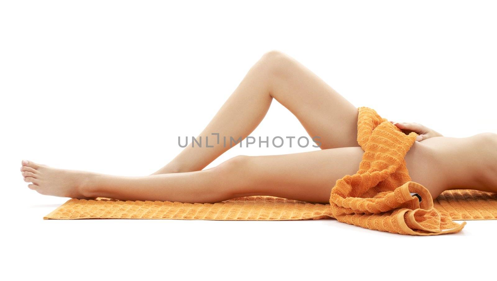 long legs of relaxed lady with orange towel by dolgachov