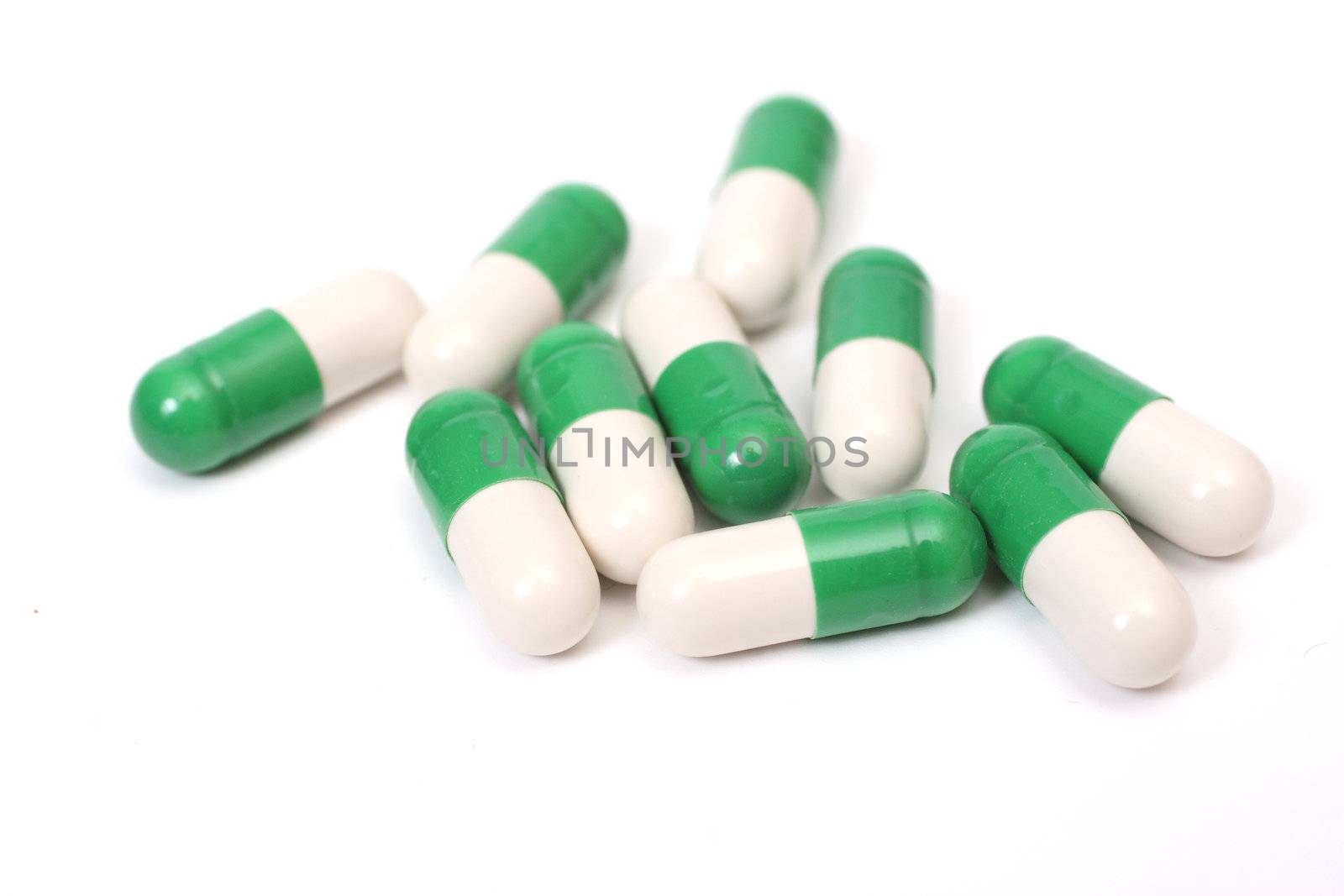 Ten white-green capsules