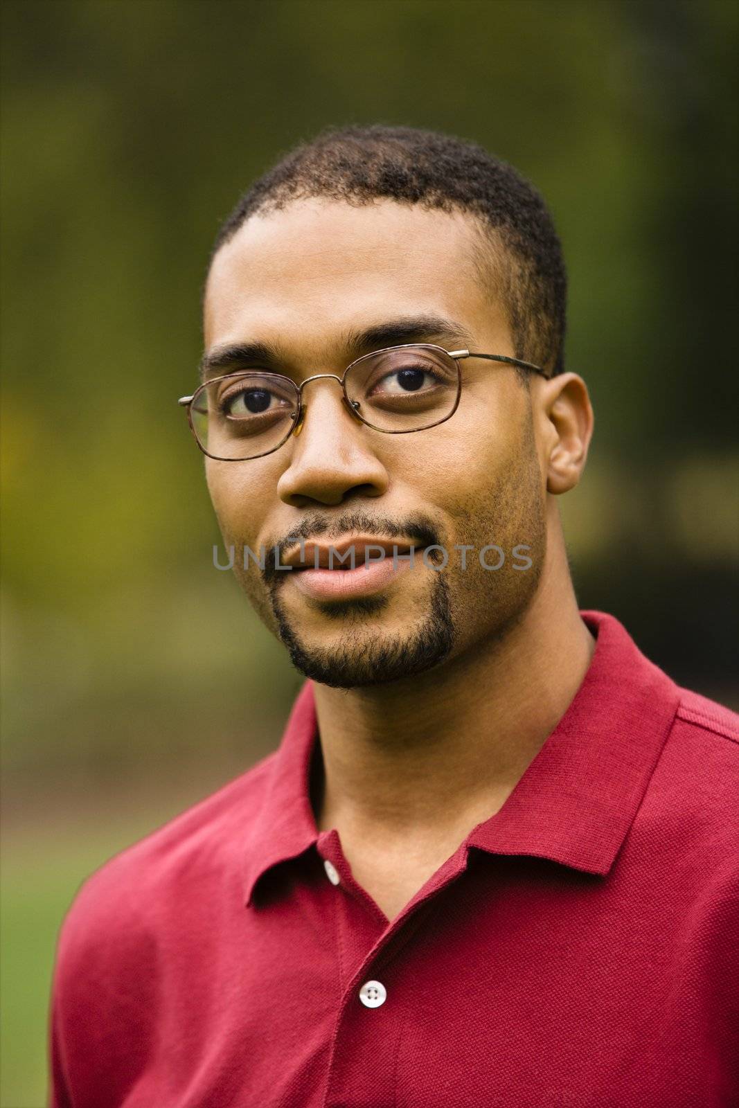 Head and shoulder portrait of African American adult man.