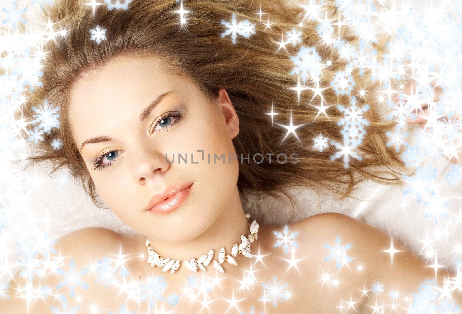 lovely topless girl with shell beads and snowflakes