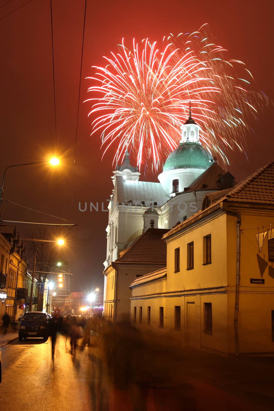 Celebratory fireworks behind a Catholic church