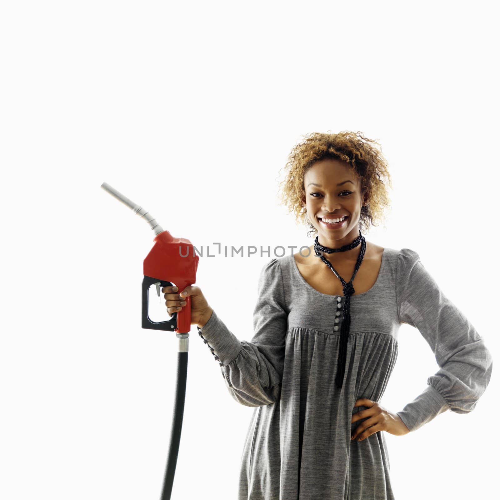 Smiling woman with petro hose by iofoto