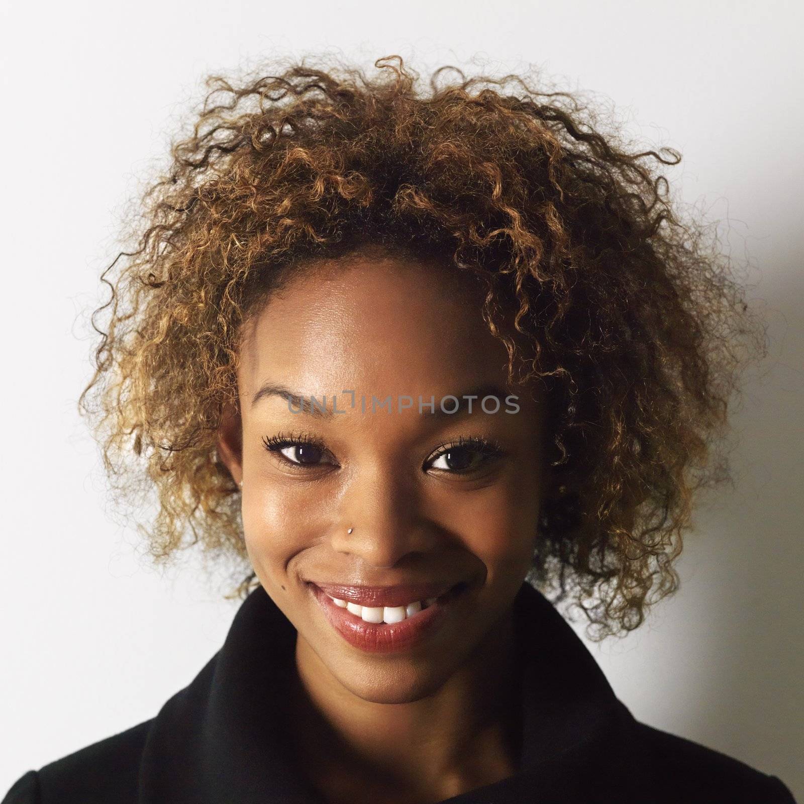 Headshot of pretty smiling young woman.
