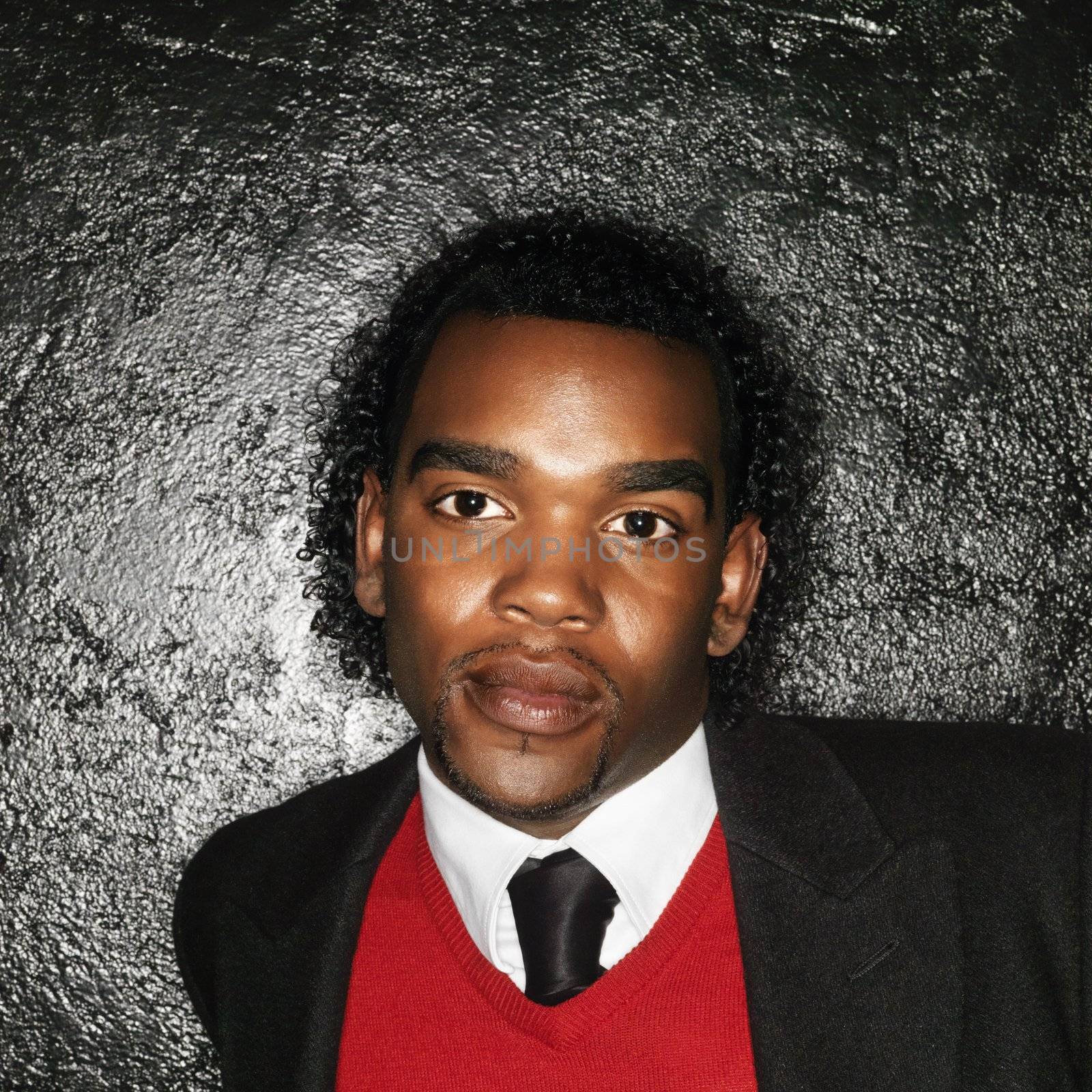 Head and shoulder portrait of well dressed young man.