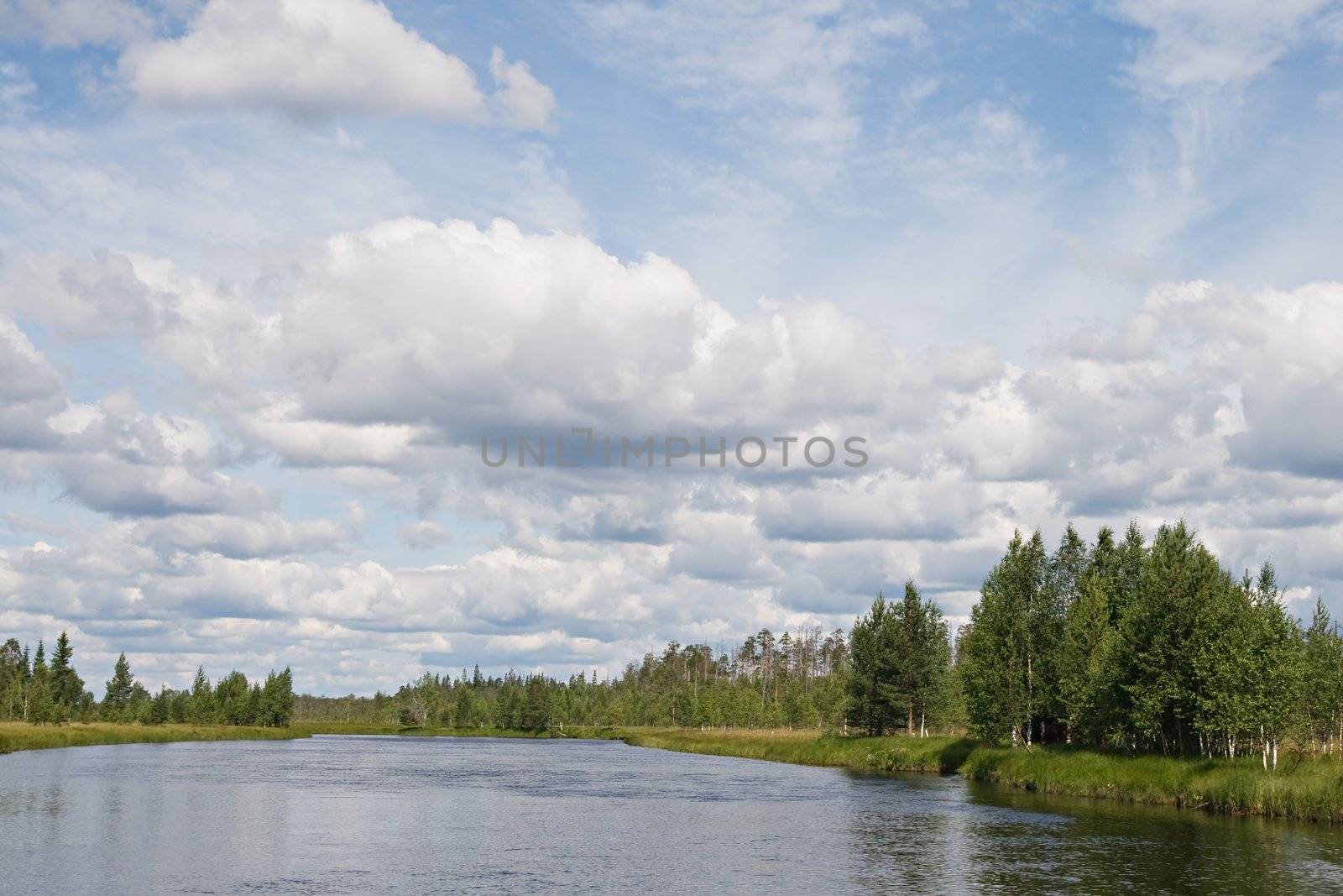 Landscape of Karelian lake and sky with clouds