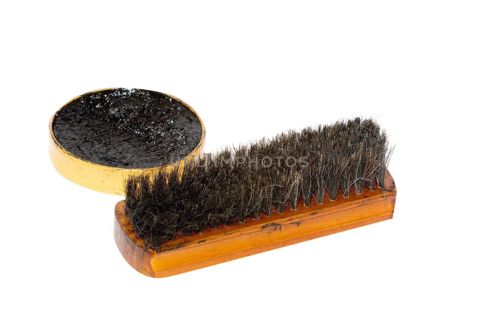 Shoe wax and a brush isolated over white