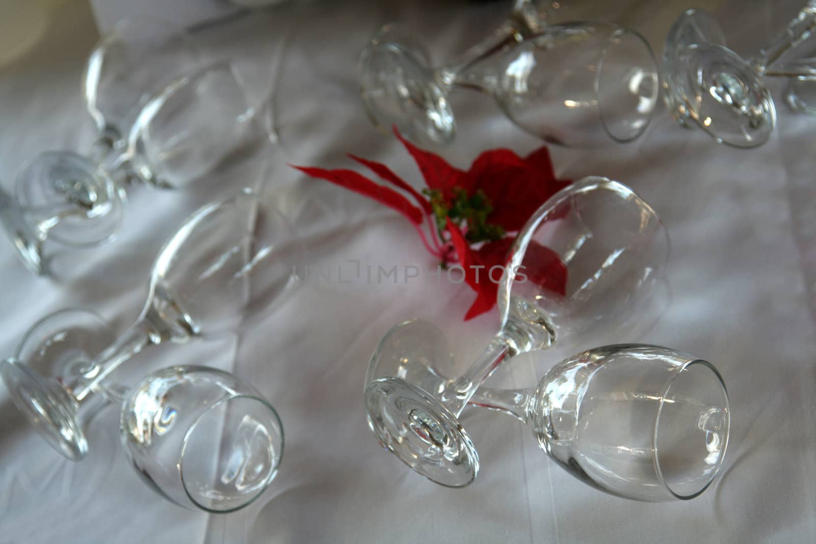 Decorative wine glass setting on a table.