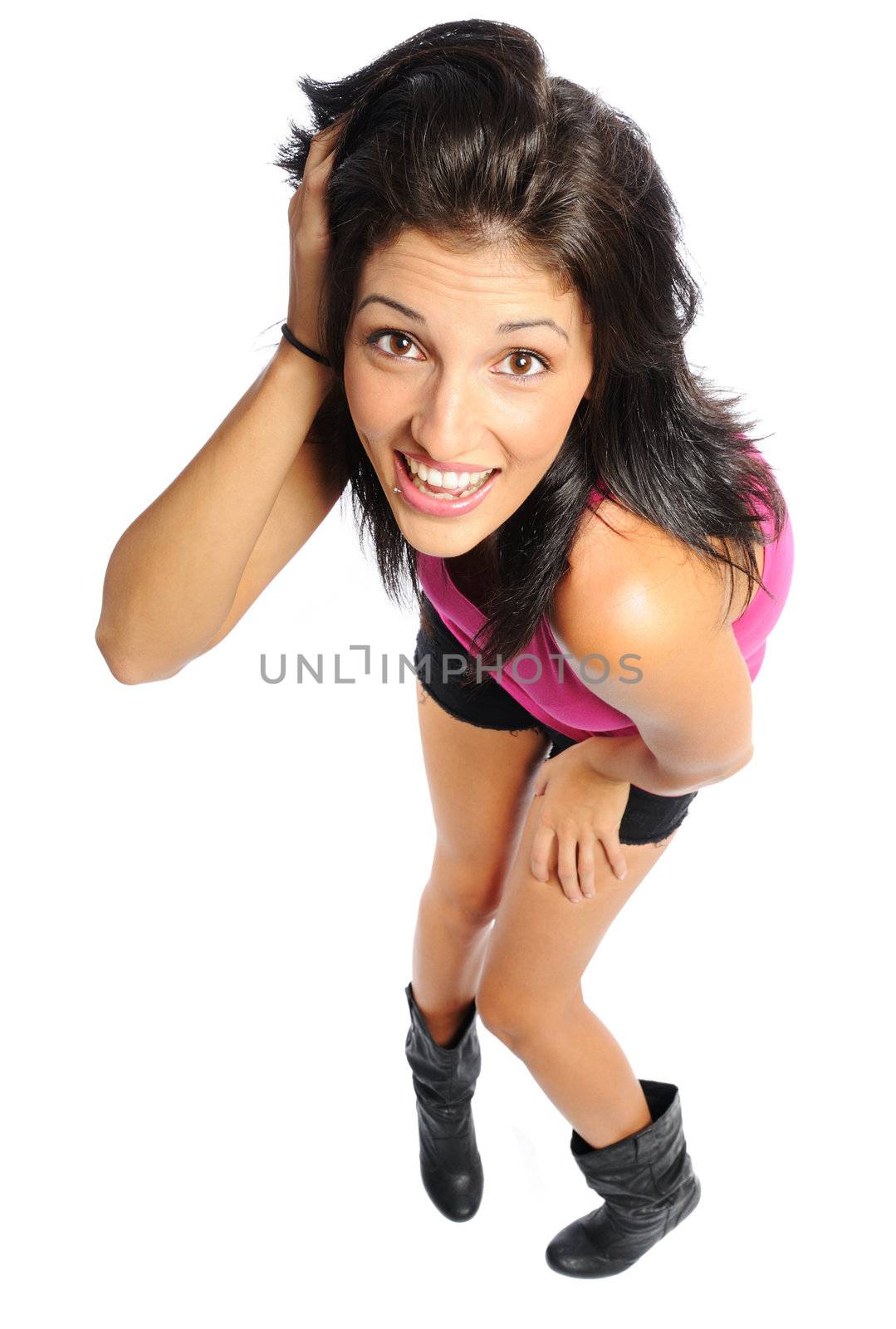 Attractive young hispanic woman in shorts and t-shirt on a white background