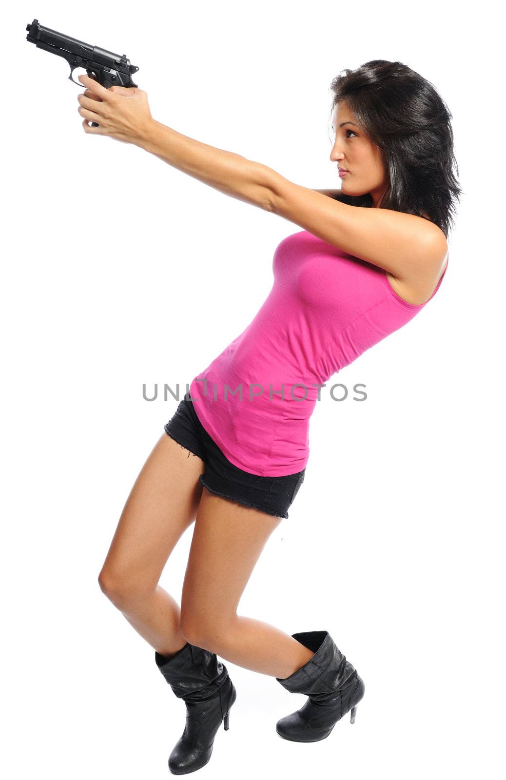 Attractive young hispanic woman with a gun on a white background