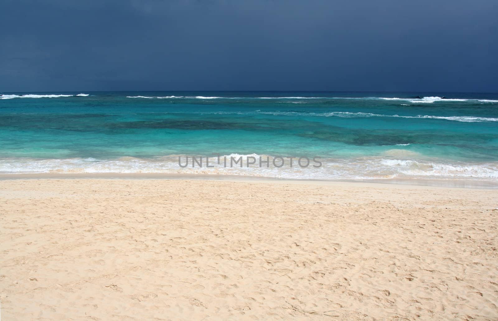 The tropical beach of Punta Cana, Dominican Republic.  Shot on an overcast day.