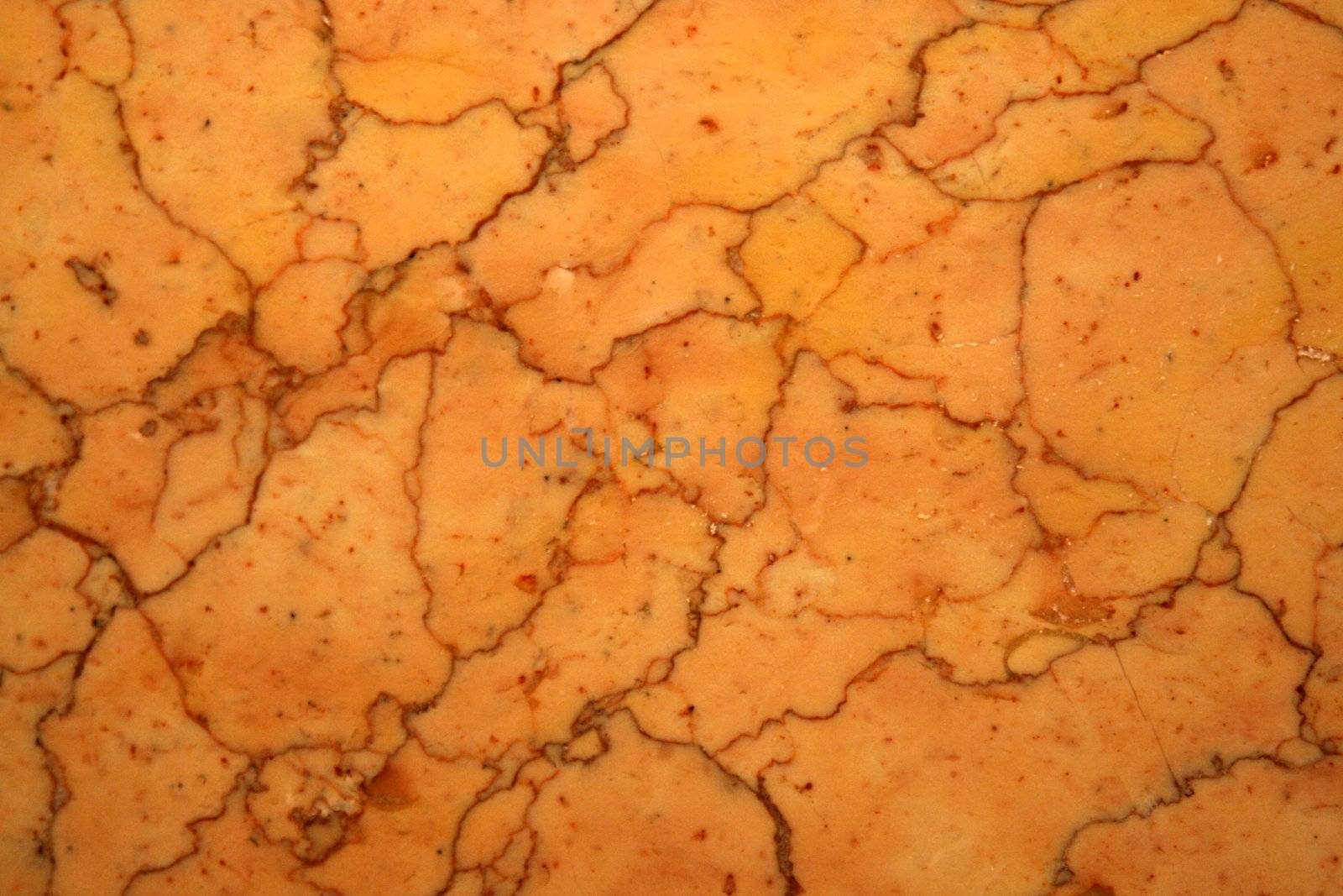 Close-up of orange marble tile.