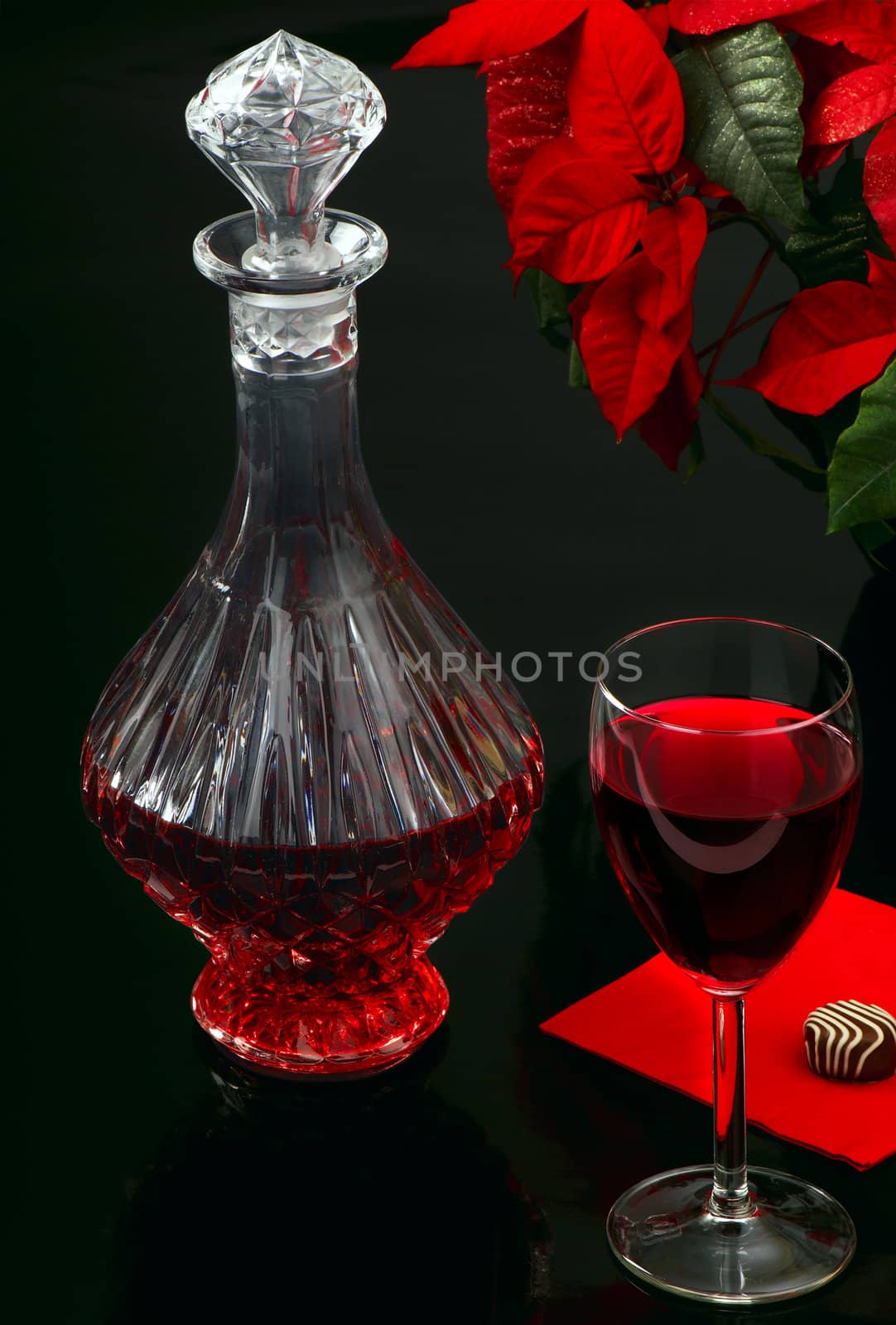 Still-life with red wine on a black background