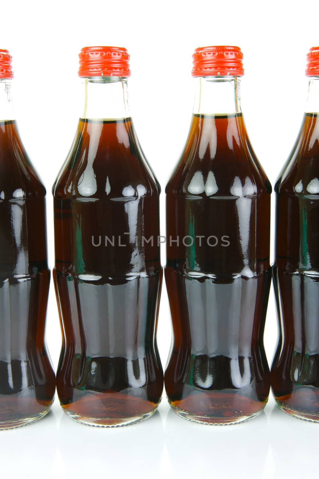 Cola bottles isolated against a white background