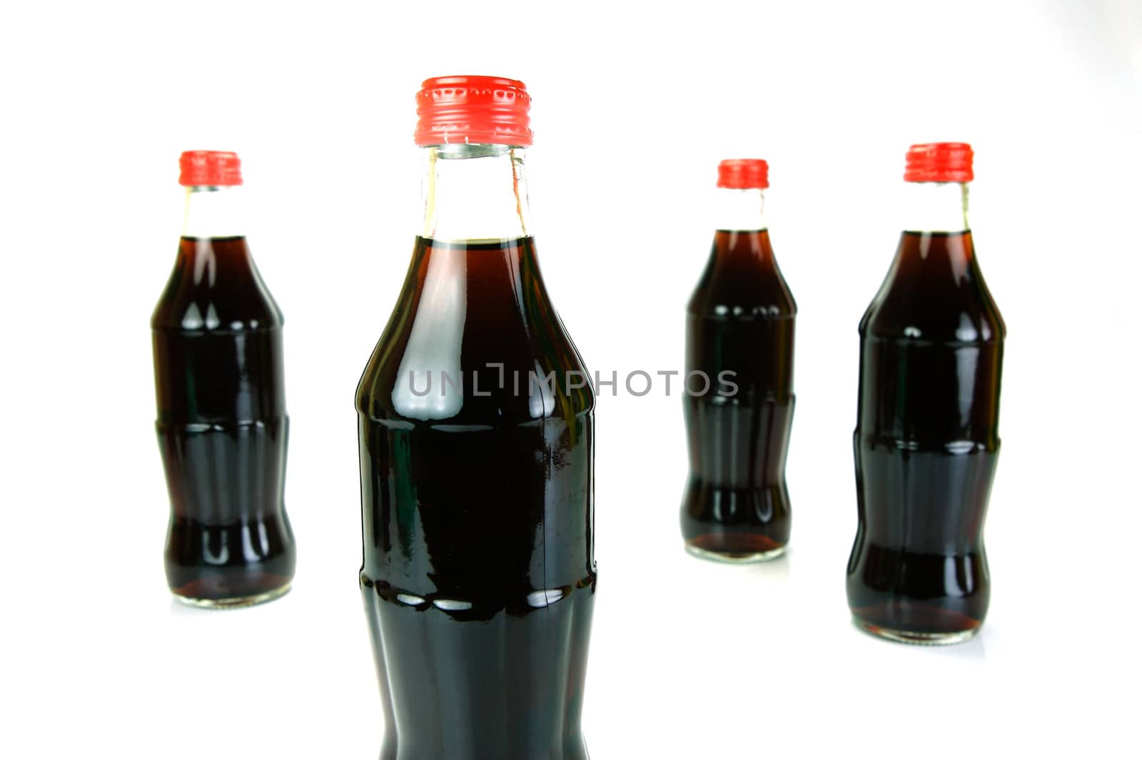 Cola bottles isolated against a white background