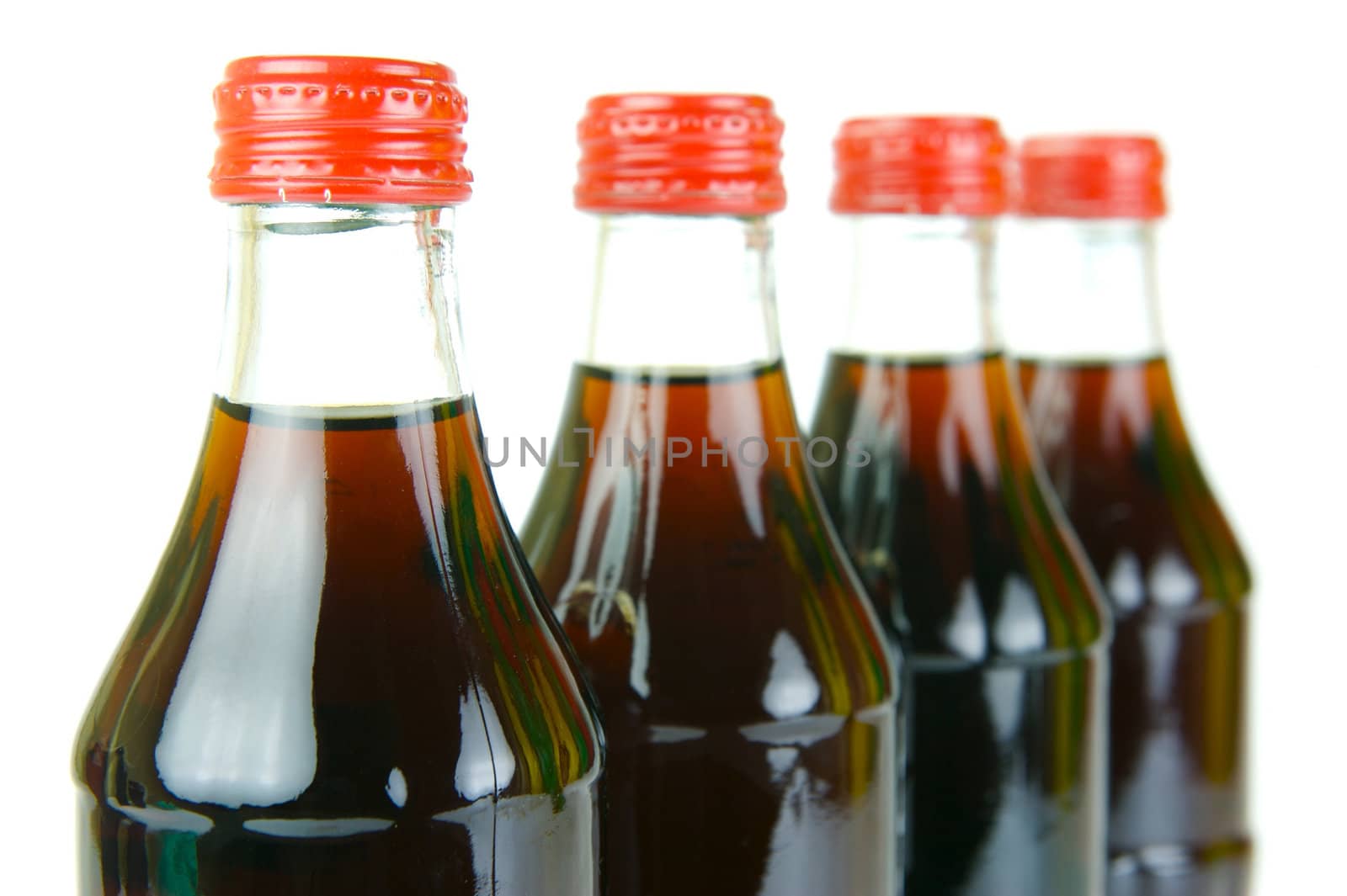 Cola bottles isolated against a white background