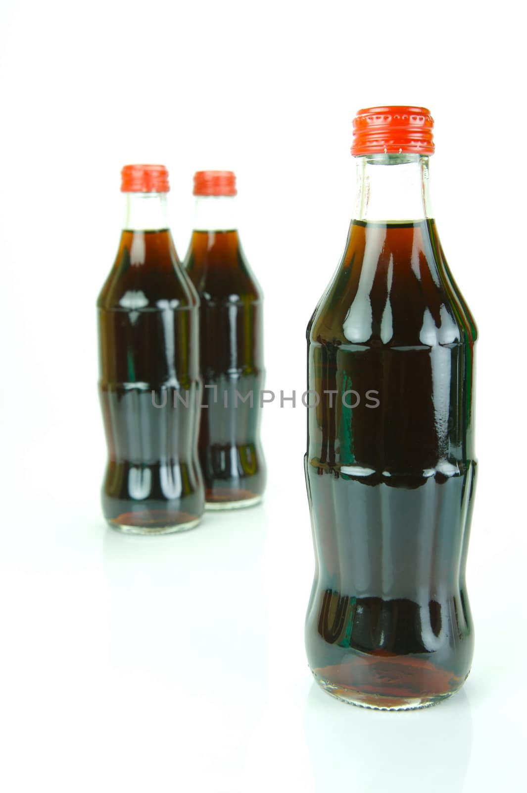 Cola bottles isolated against a white background