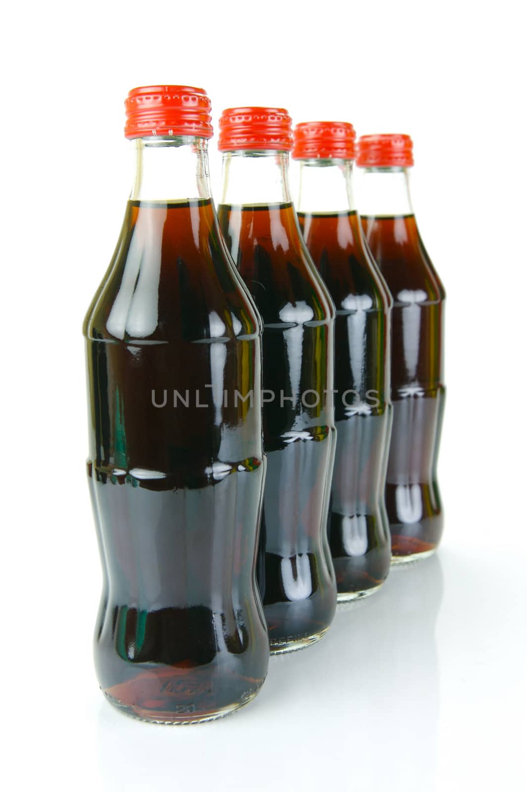 Cola bottles isolated against a white background