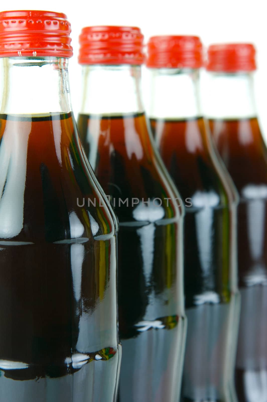 Cola bottles isolated against a white background