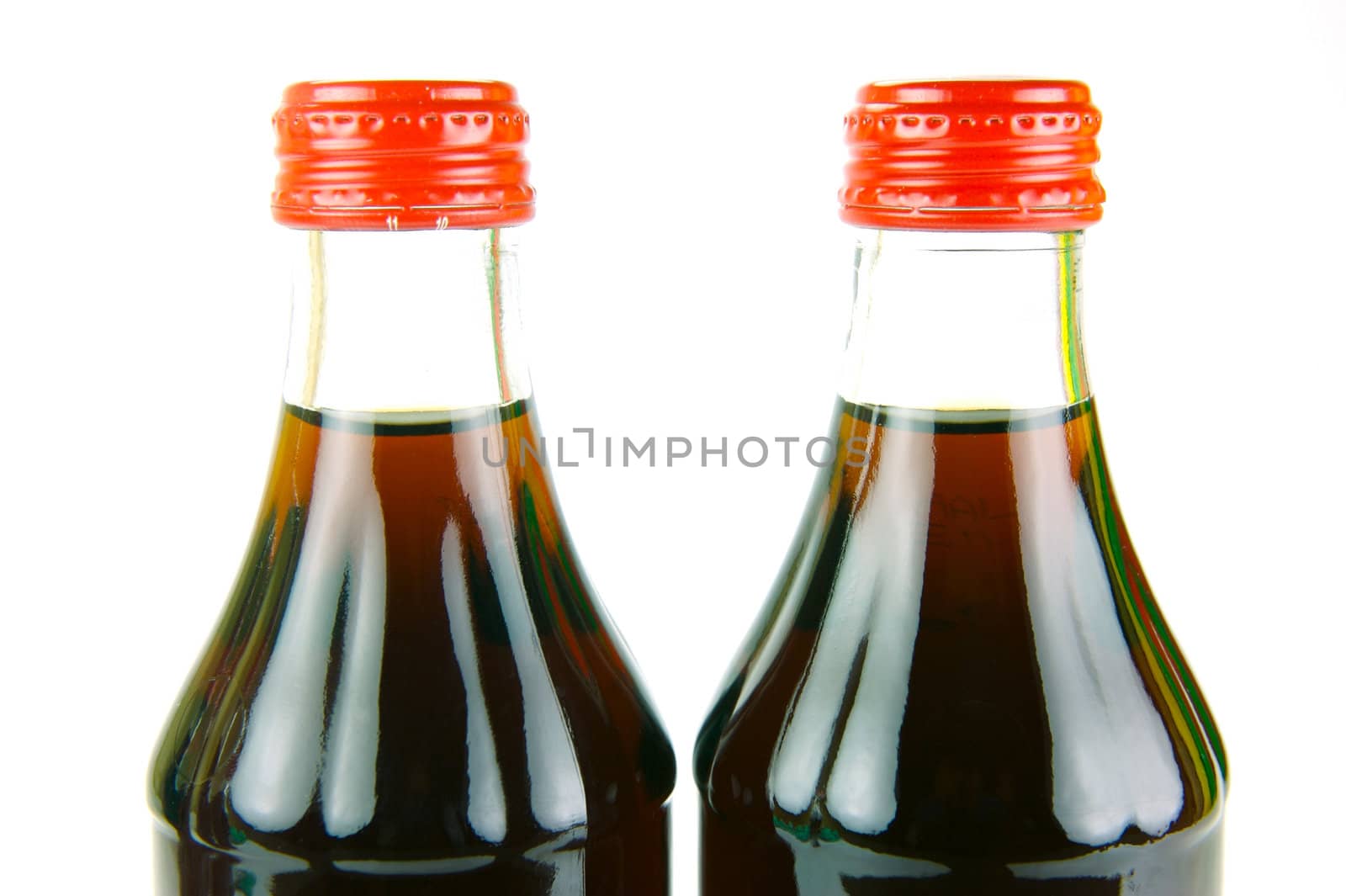 Cola bottles isolated against a white background