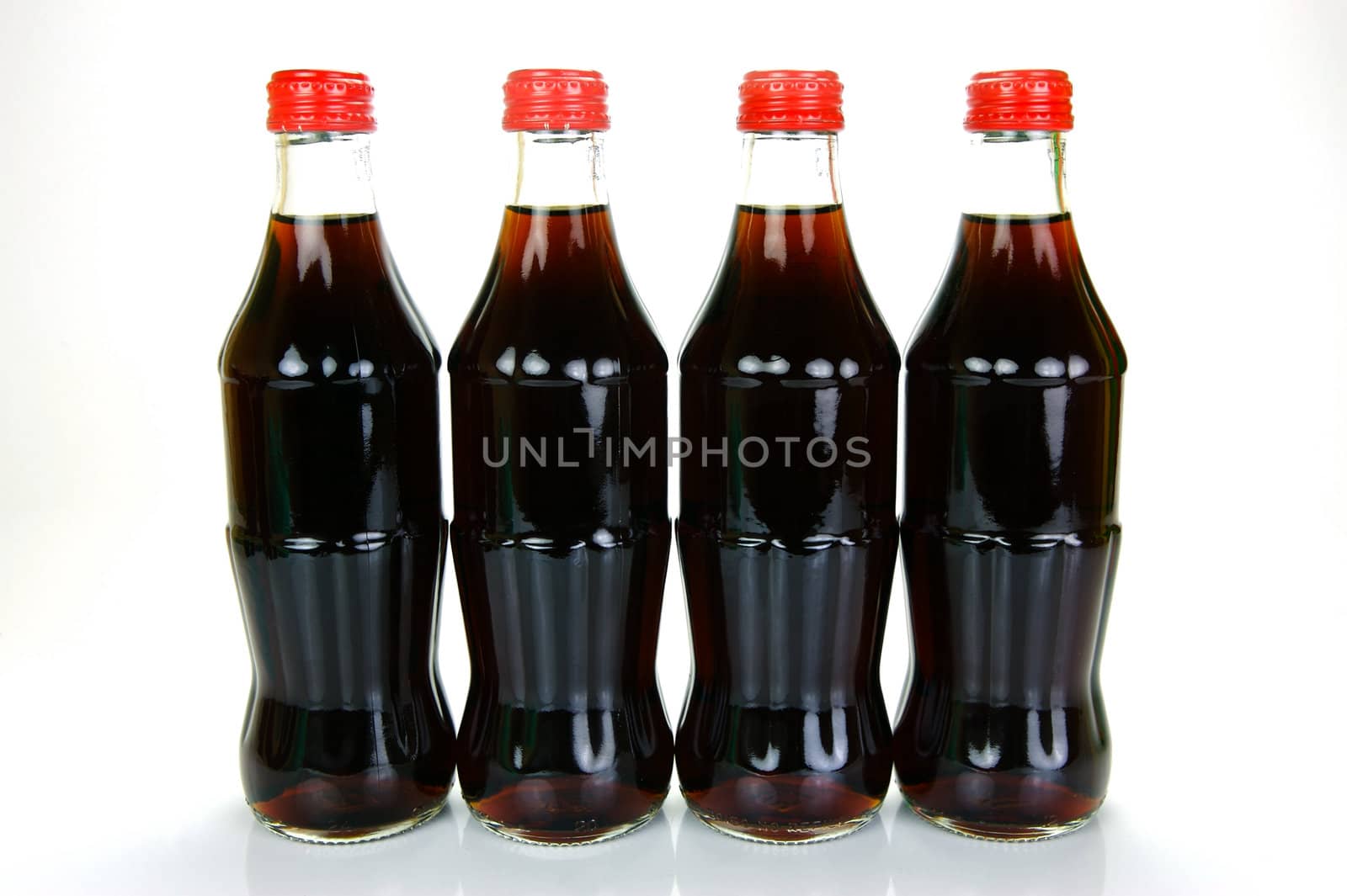 Cola bottles isolated against a white background