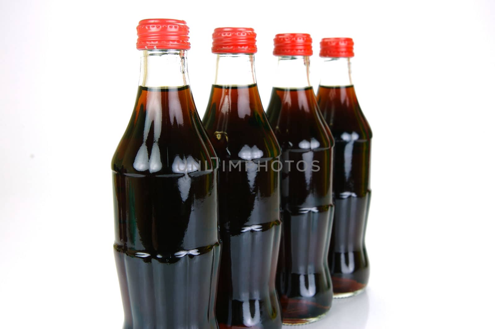 Cola bottles isolated against a white background
