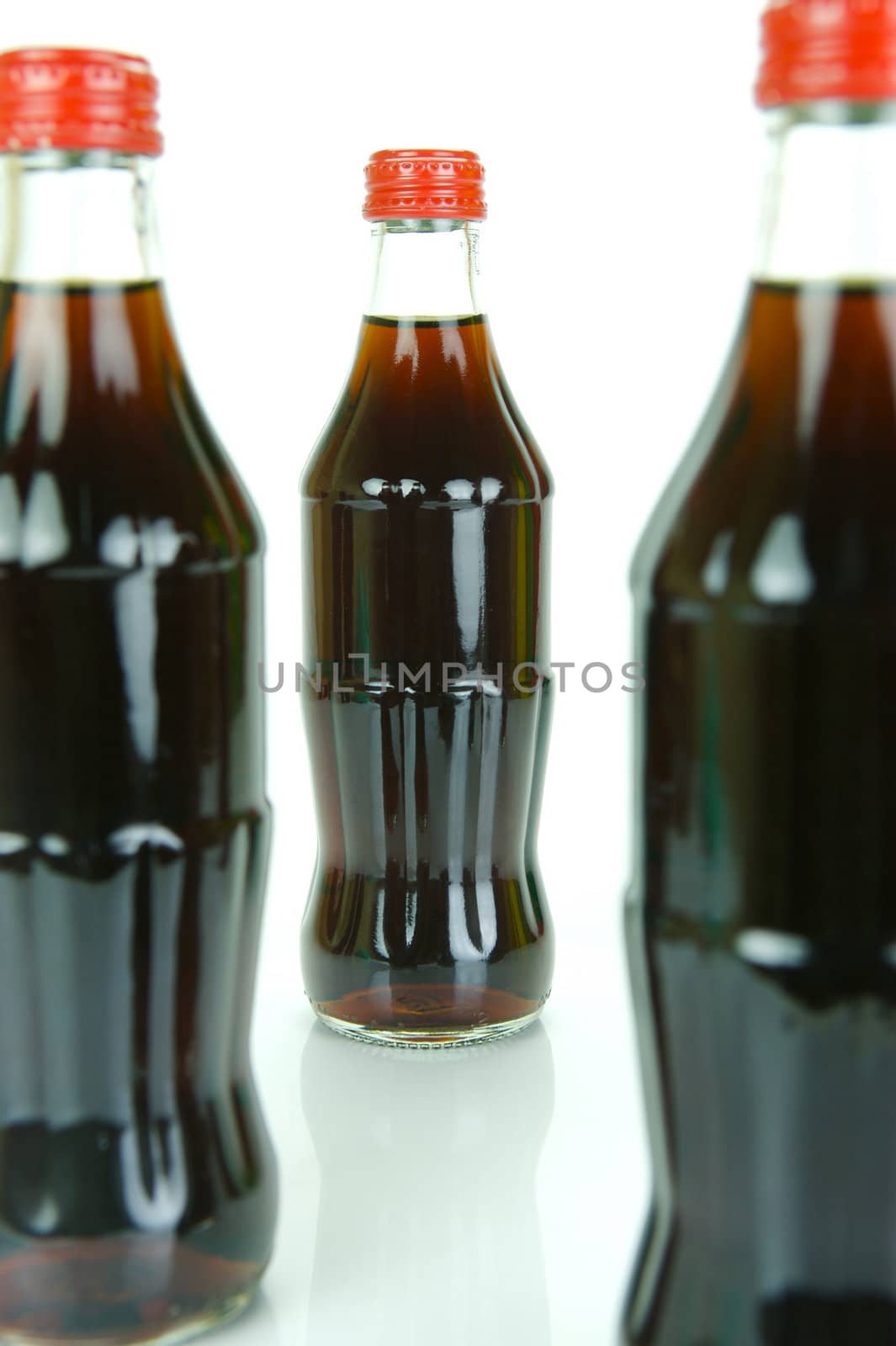 Cola bottles isolated against a white background