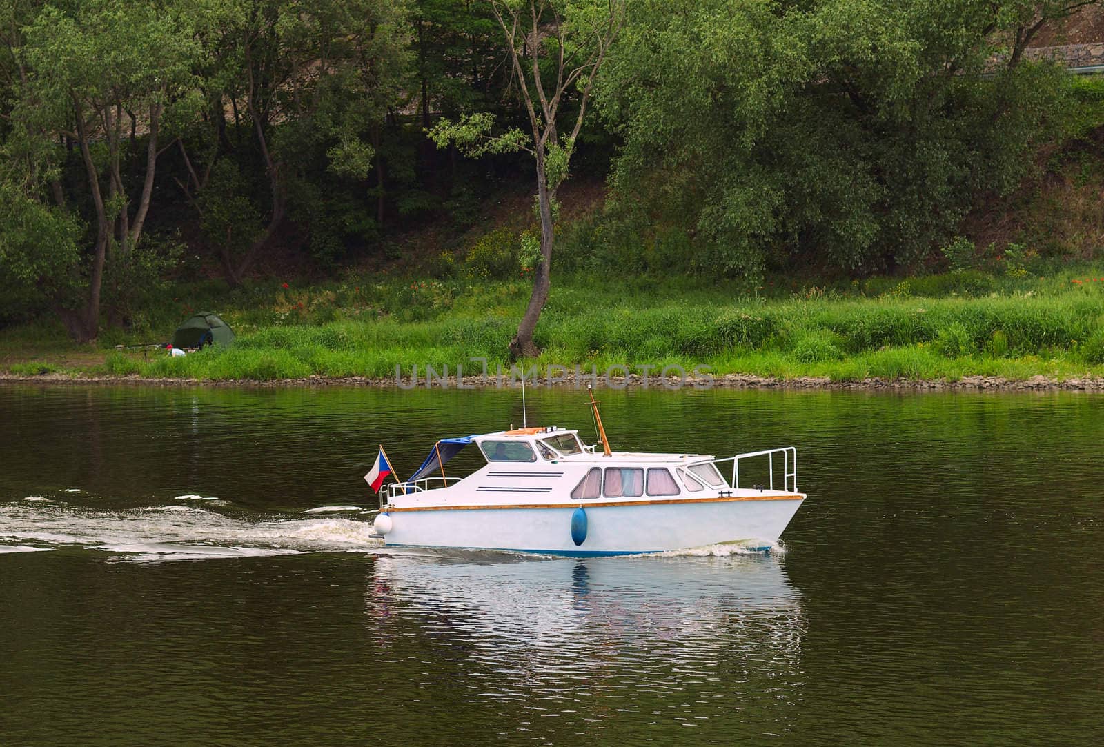 Small boat on river. Summer.