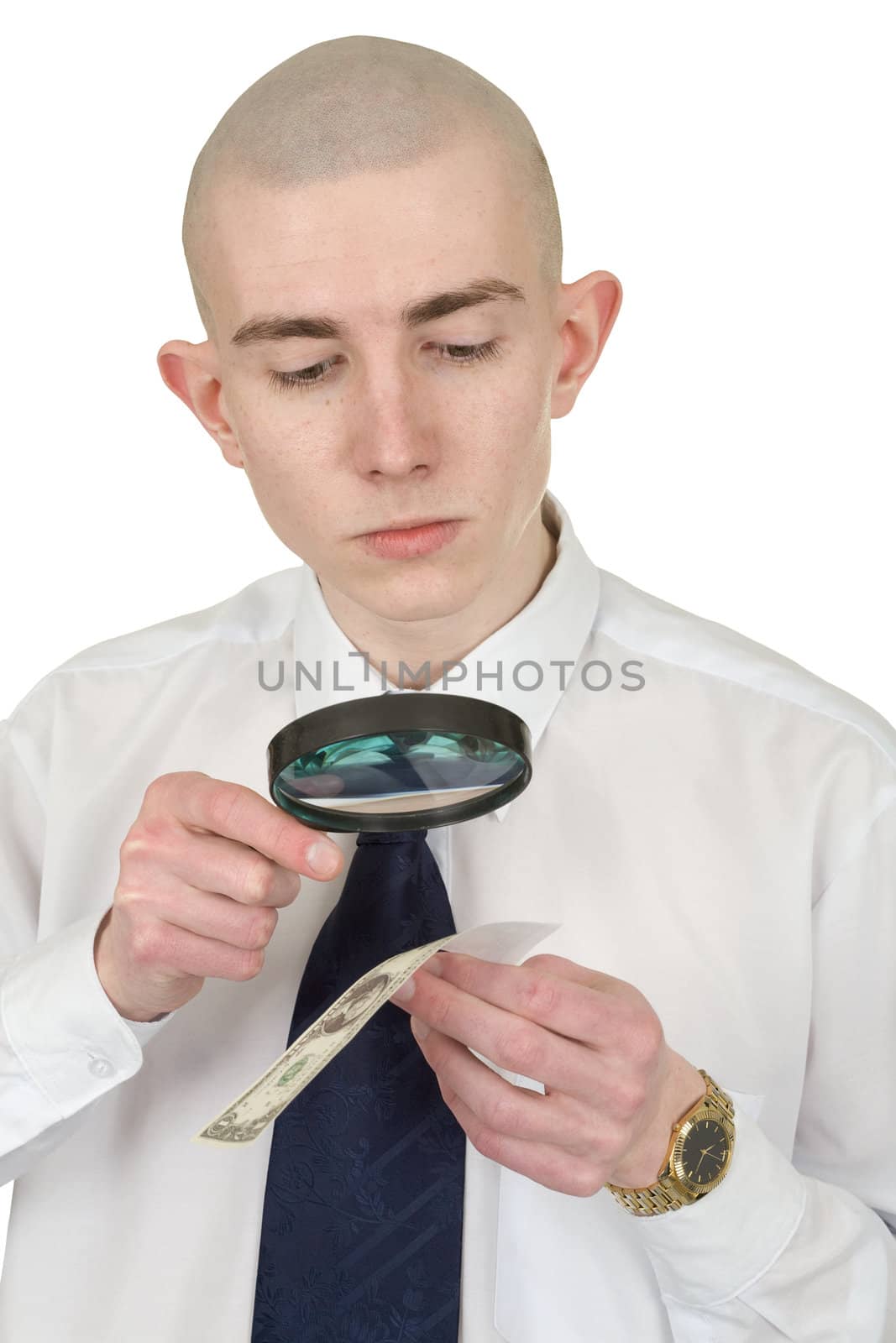 The man studying a counterfeit money by means of a magnifier