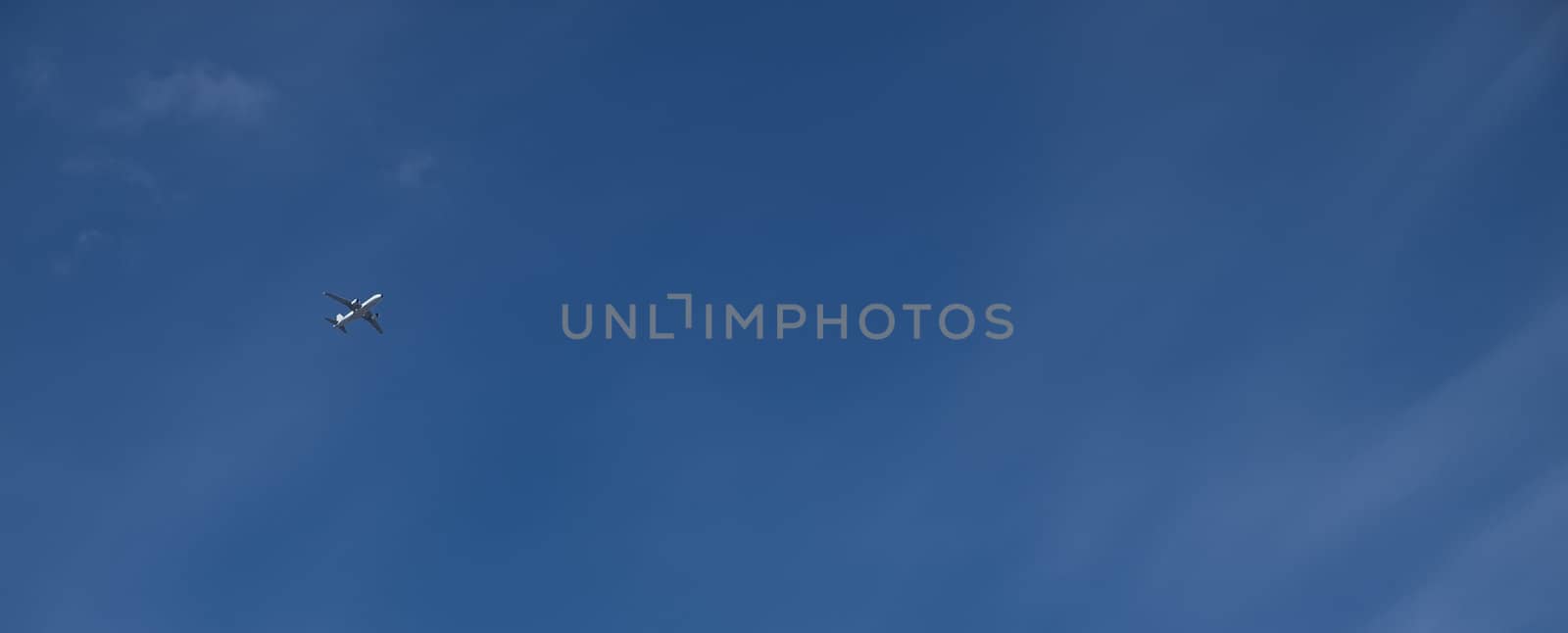 Conceptual image showing civil airliner over blue sky