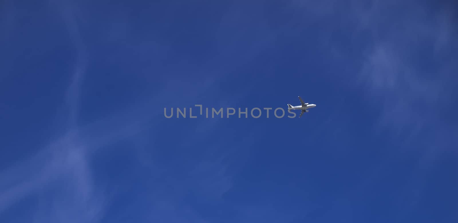 Conceptual image showing civil airliner over blue sky