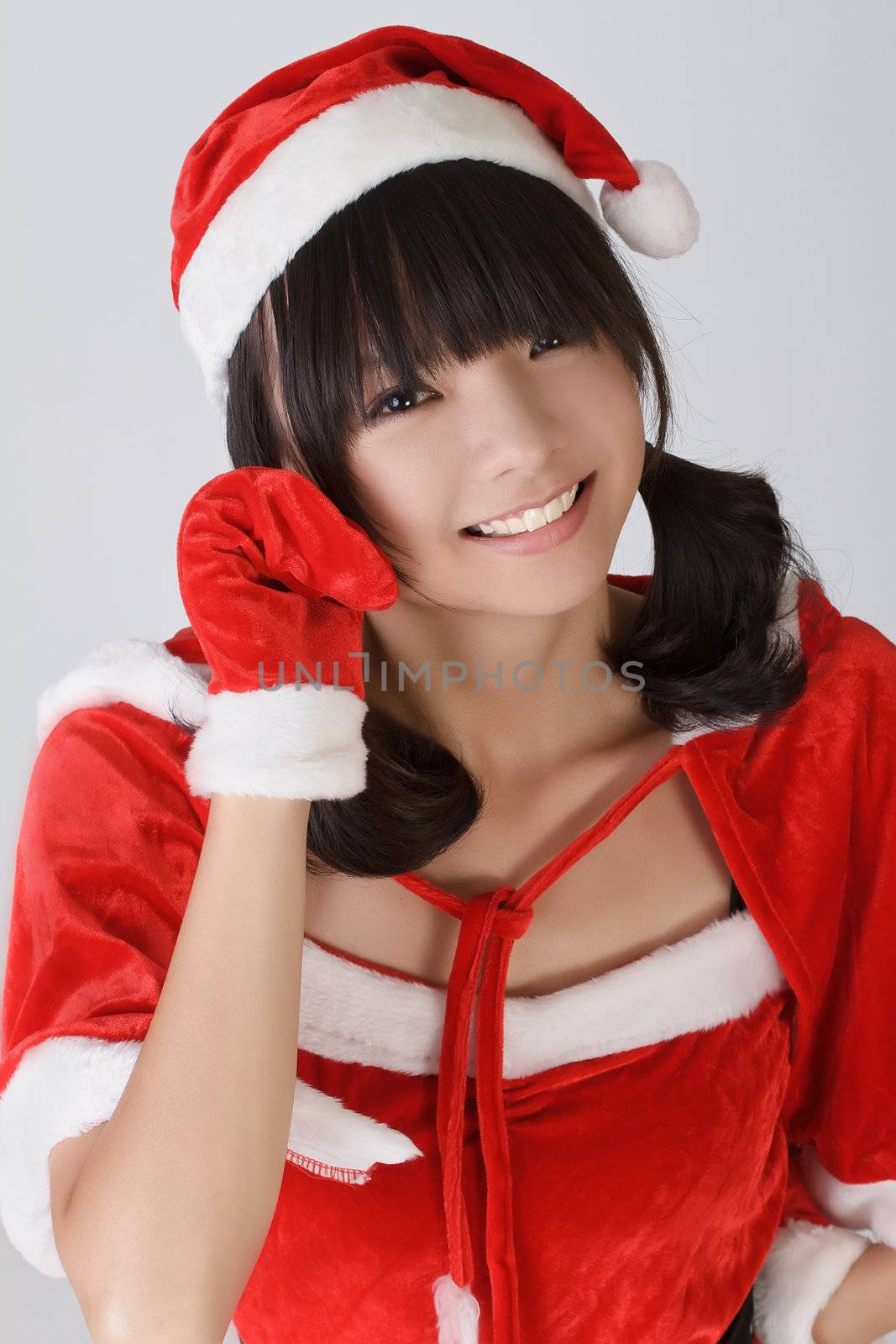 Cute Christmas girl with smiling expression and happy face.