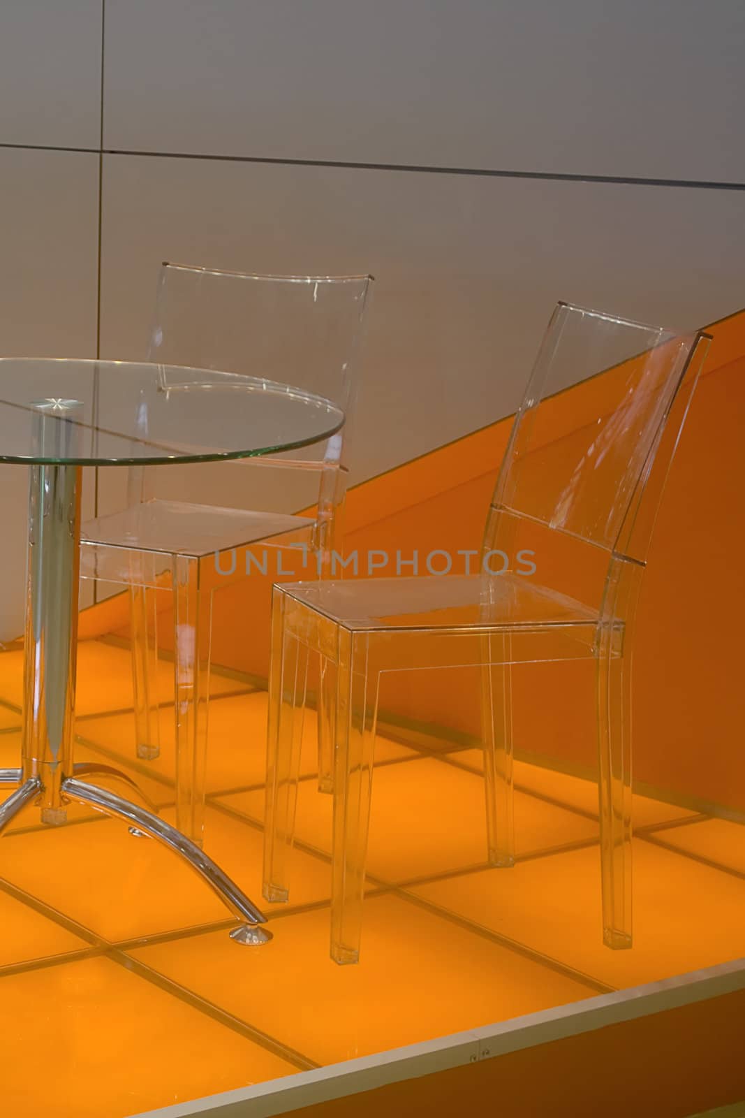 Table for negotiations, with plastic and transparent chairs.