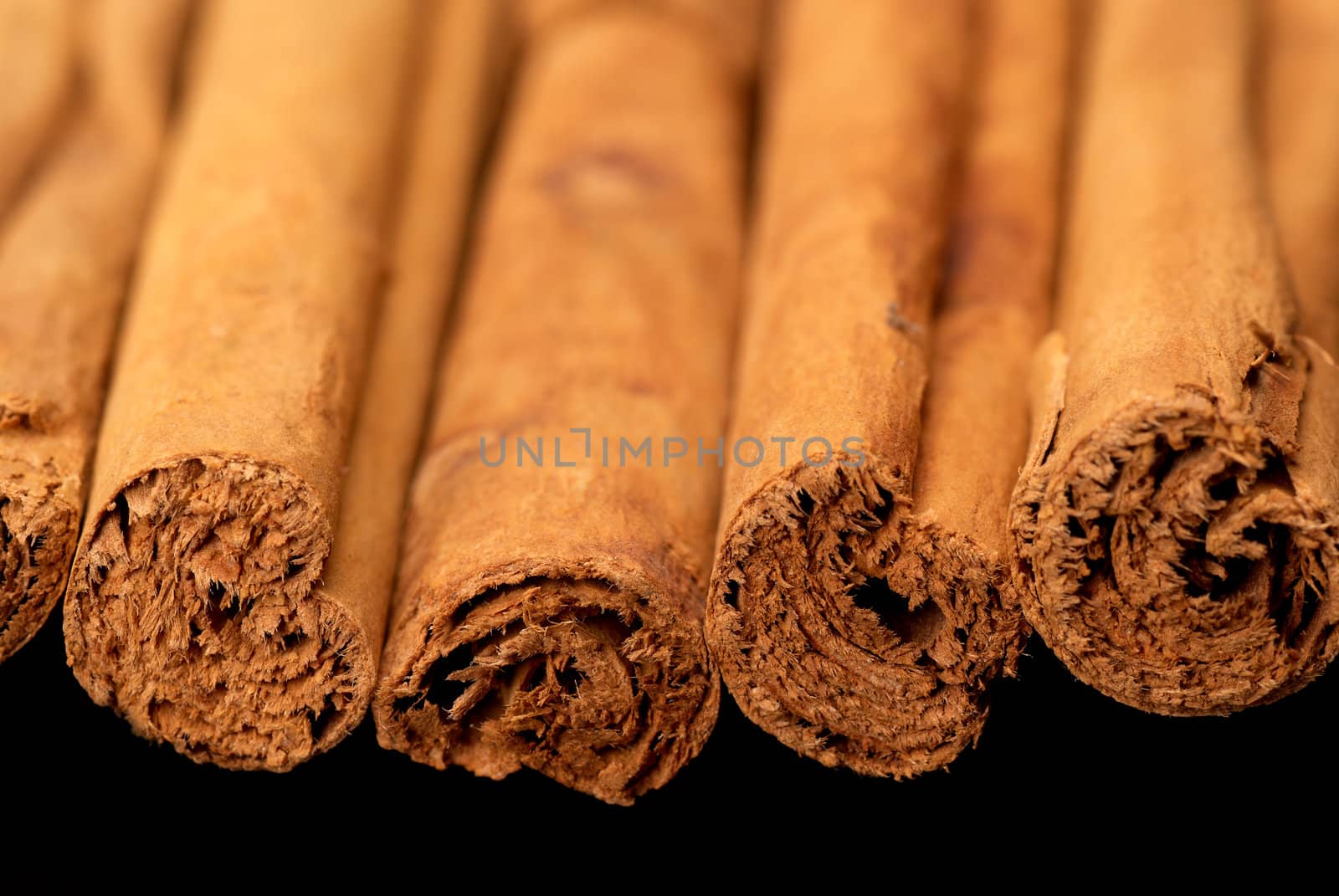 Cinnamon sticks taken with shallow DOF isolated on black