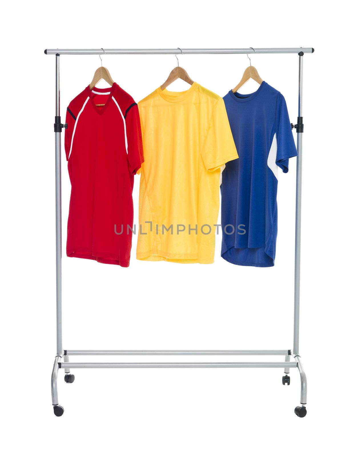 Colored shirts on a Clothes Rack isolated on white background