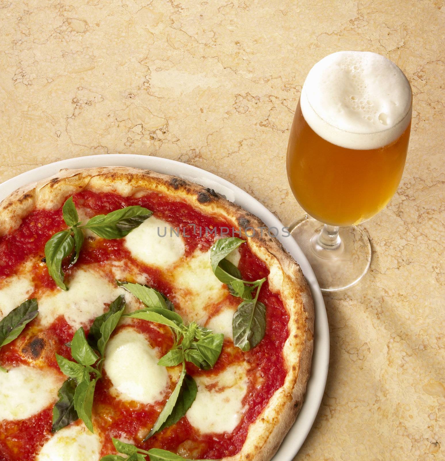 pizza whit mozzarella and glass of beer