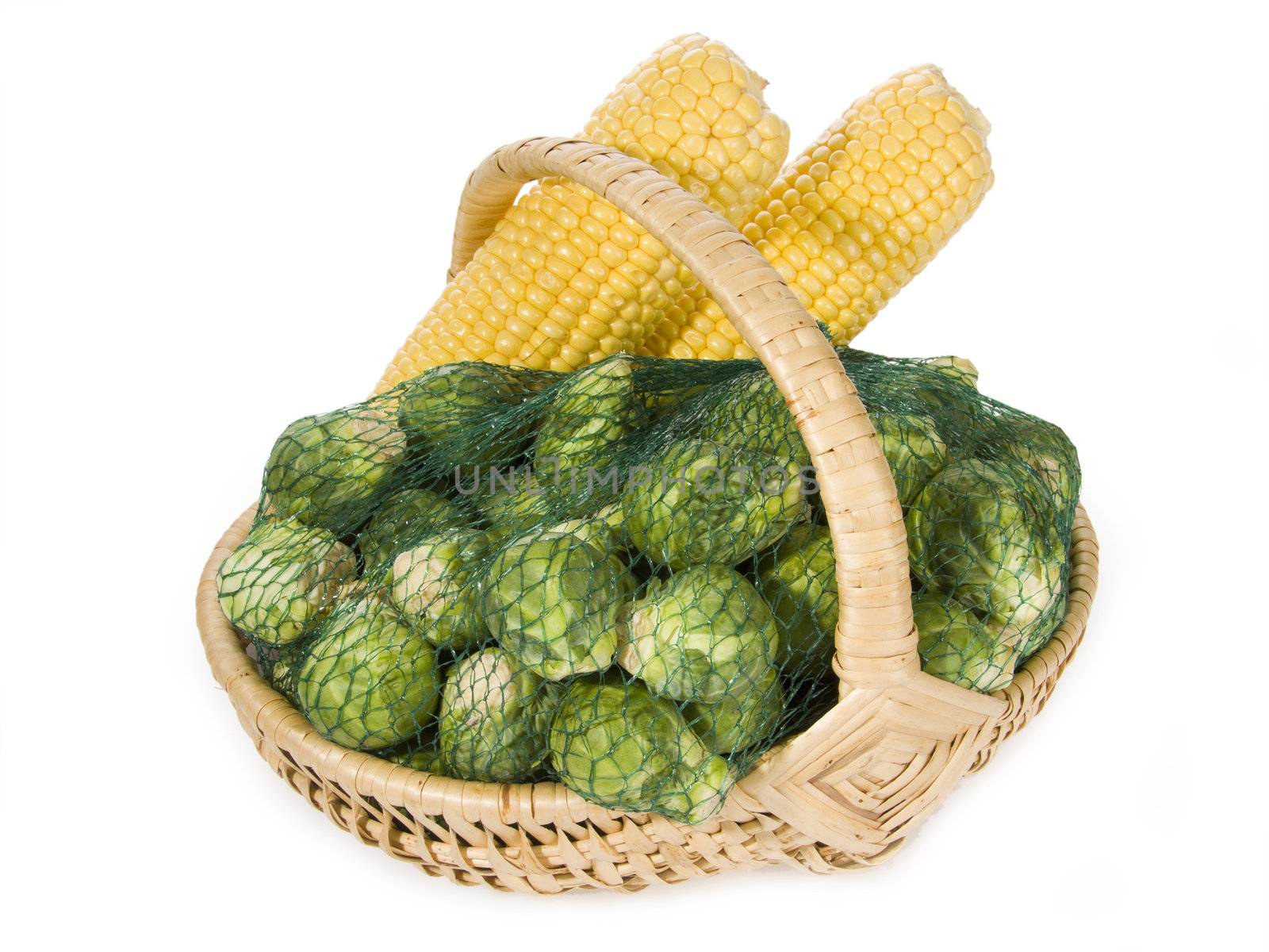 Brussels sprouts and maize-cob in a basket