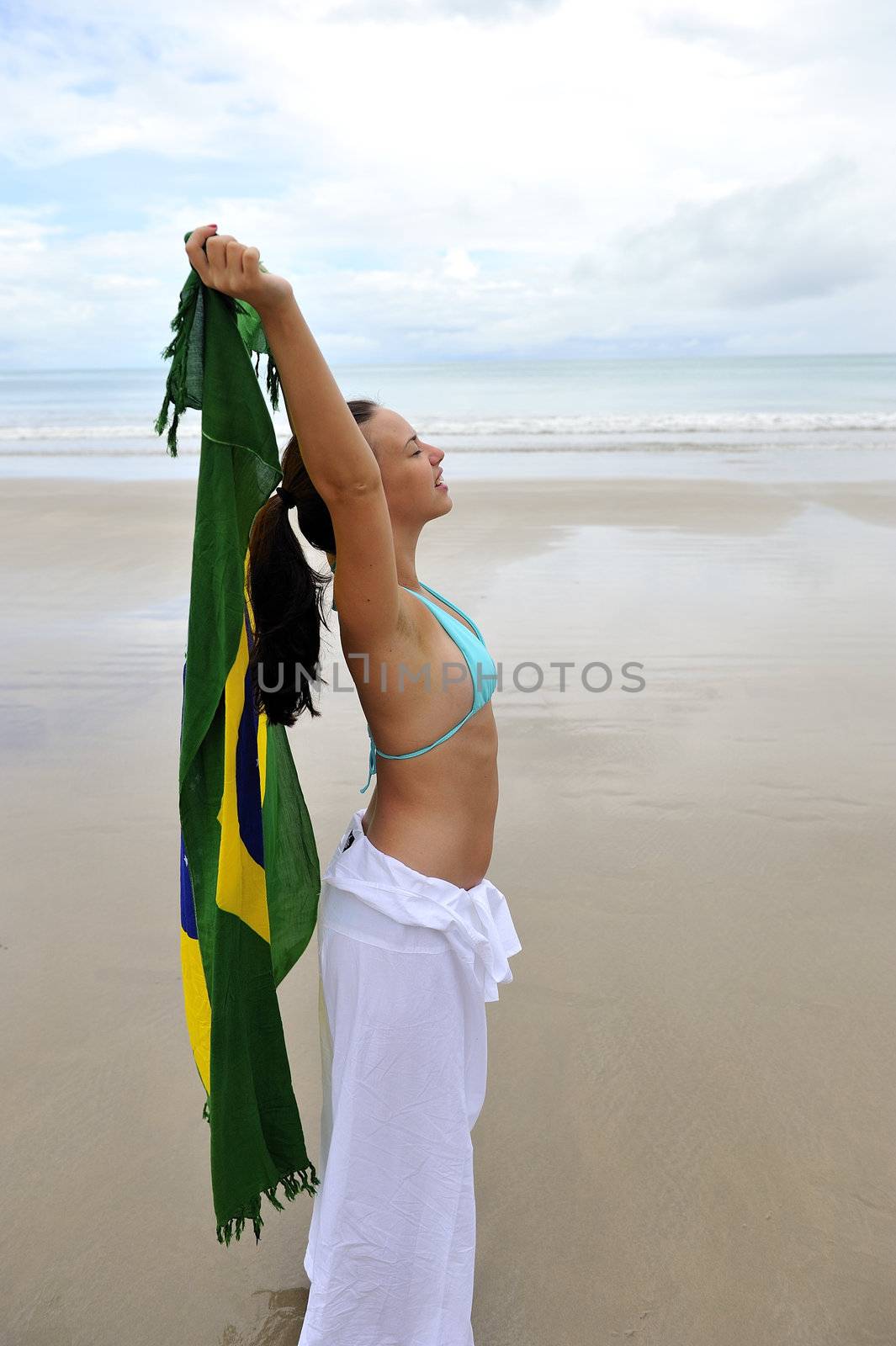 Woman playing with a Brazilian flag
