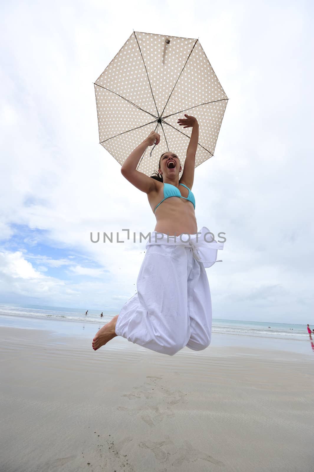 Woman enjoying her holiday in the beach in Brazil
