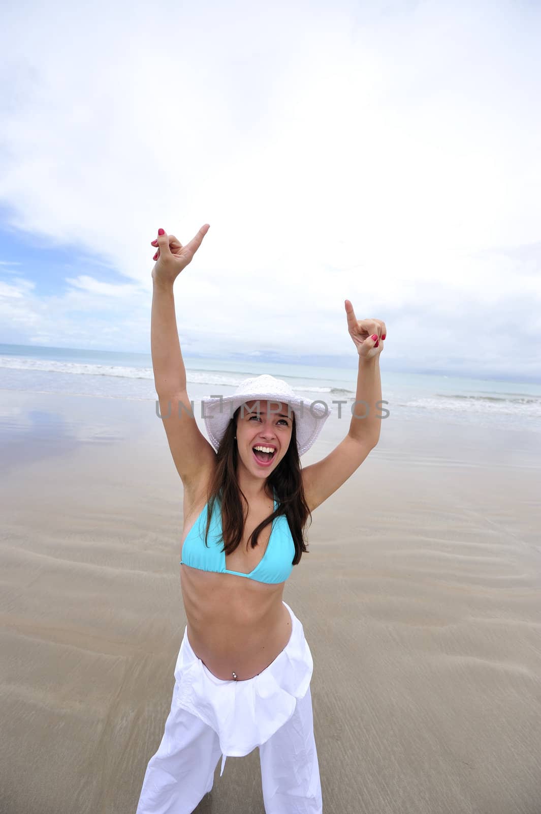 Woman enjoying her holiday in the beach in Brazil
