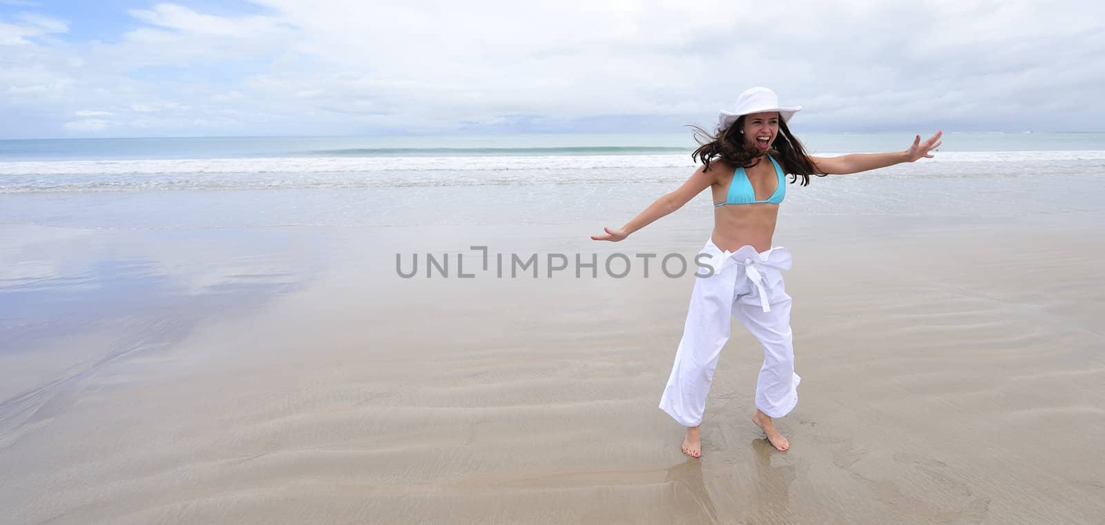 Woman enjoying her holiday in the beach in Brazil
