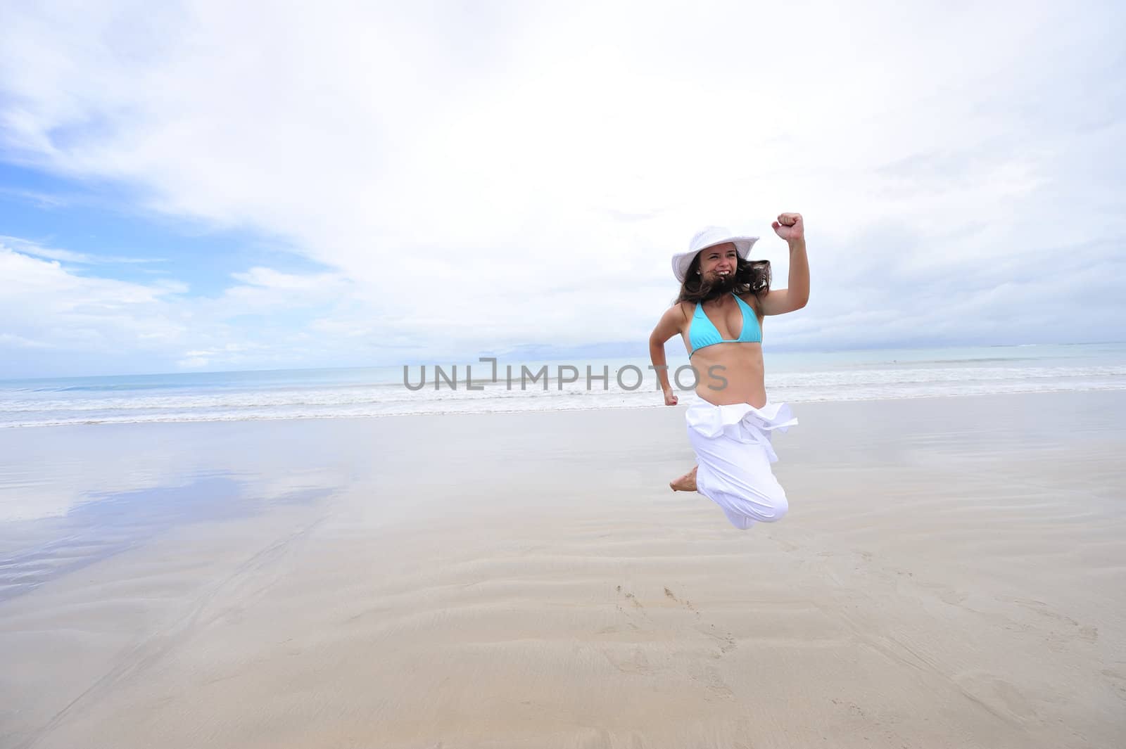 Woman enjoying her holiday in the beach in Brazil
